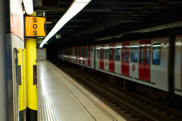 Sign symbol SOS.Subway metro train station platform with. Metropolitan railroad, railway