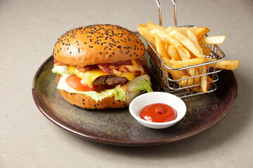 Sticky beef burger with fries on plate