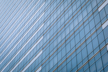 Amazing high-rise glass building with a huge number of identical windows, background