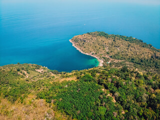 Fototapeta na wymiar Beach, waves and uninhabited island from top view. Turquoise water background from top view. Top view from drone.