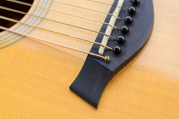 Fototapeta premium The musician replace the new guitar strings for his guitar