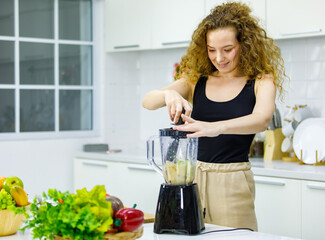 Happy healthy curly hairstyle young sexy Caucasian pregnancy mother model in casual outfit standing...