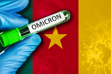 Cameroon outbreak of omicron variant. Hand holds a test tube with covid-19 virus omicron in front...