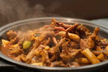 close up steaming bullfrog in pot. Delicious spicy bullfrog cuisine. Chinese food