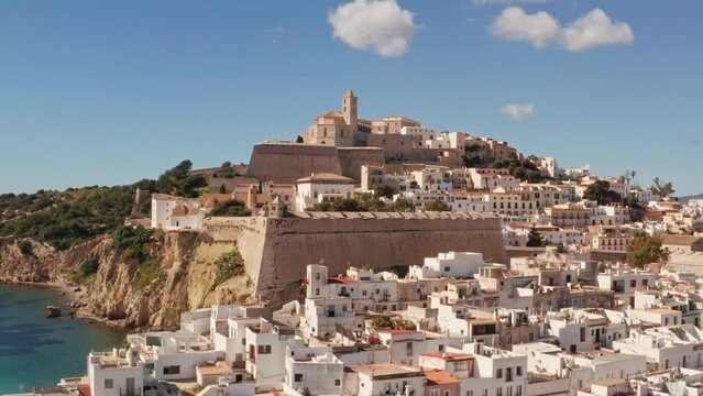 Aerial view of fortress in Ibiza city, the Old Town and the city walls of Eivissa, in the island of Ibiza, on a sunny and clear day.
