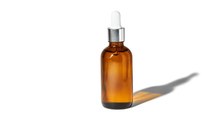 Essential oil in glass bottle with dropper isolated on a white background with clipping path. Cosmetic medical beauty product for aromatherapy. Alternative medicine.