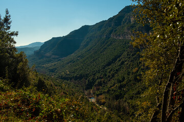 landscape view of catalan mountains and meadows in Sant Miquel del Fai in the Catalonia countryside. Rural catalunya and nature