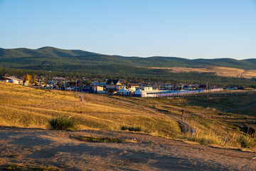 View of the village of Khuzhir from Shamanka Rock on lake Baikal at Olkhon island in September, Siberia, Russia.