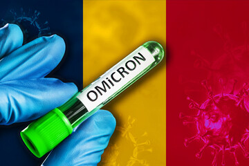Chad outbreak of omicron variant. Hand holds a test tube with covid-19 virus omicron in front of...