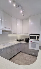 white-gray built-in kitchen furniture. simple solutions for the apartment.