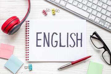 Learnging English concept. Handwritten text on notebook on student table