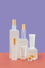 Various blank cosmetic containers on the stairs. Background for  presentation. Skincare beauty products. Copy space