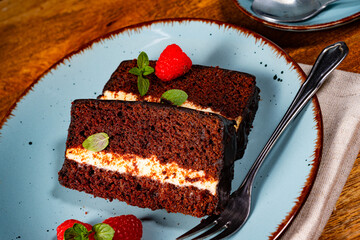 Rustic chocolate cake with raspberries and coffee