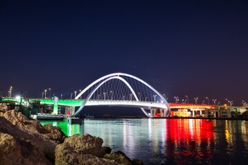 Newly opened Infinity bridge with reflections of United Arab Emirates flag in Dubai