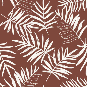 Palm tree leaves seamless repeat pattern. Random placed, hand drawn plant elements all over surface print on brown background.