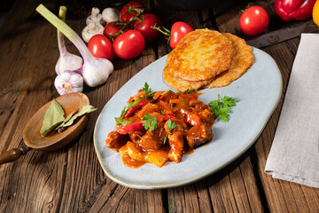 Original Hungarian goulash with potato pancakes