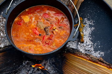 Kettle goulash is prepared over an open fire!