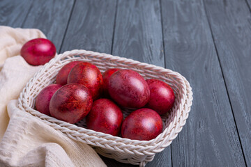 Beautiful decorated traditional Easter eggs on the gray wooden background.