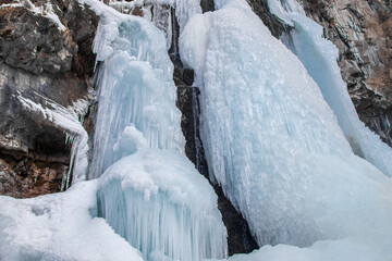 Frozen Butakov Waterfall in gorge in the suburb of the city of Almaty in Kazakhstan.
