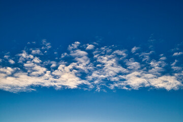Blue beautiful sky with line of white clouds