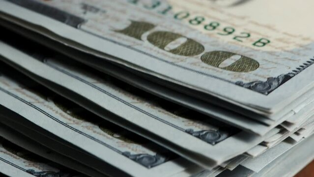 Close up currency US dollar banknotes. Income and Business concept.