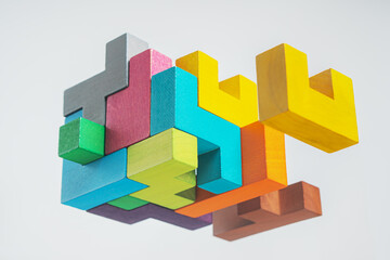 Obraz premium Abstract construction from wooden blocks. The concept of logical thinking..