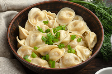 dumplings boiled on a wooden background macro, Russian national food