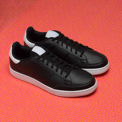 black sneakers on the red background