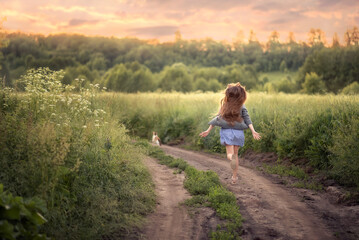Photo of a running girl on a country road. © Елена Косинова