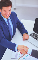 Business people shaking hands, finishing up a meeting