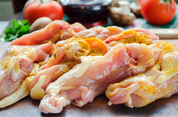 raw chicken thighs with spices and mushrooms