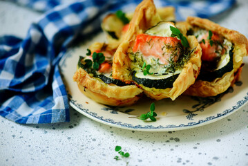 Salmon and zucchini tartlets.selective focus