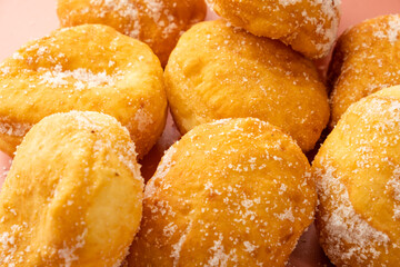 Malasada sprinkled with sugar. Portuguese donuts. Full frame.