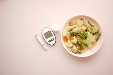 diabetic measurement tools and healthy food on table 