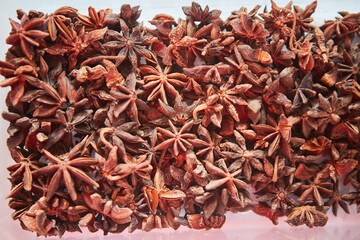 Herb spice star anise. A large amount of seasoning for the kitchen and cooking.