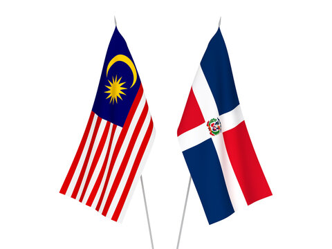 National fabric flags of Malaysia and Dominican Republic isolated on white background. 3d rendering illustration.