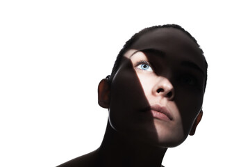 Fashionable studio portrait of a cute girl. Silhouette of a beautiful young woman with hard shadows on her face. against white backgroung