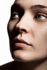 Obraz premium studio portrait of a beautiful young woman against white backgroung