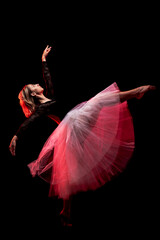 ballerina with a white dress and black top posing on red smoke background © Nikola Spasenoski