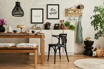 Stylish composition of cozy kitchen interior design with mock up poster frames, beige commode,...