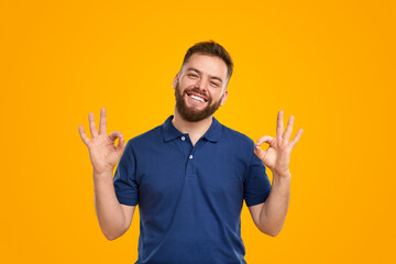 Man showing OK gesture in studio