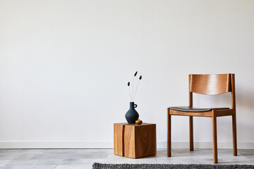 Stylish living room interior composition with creative design vintage chair, wooden cube and...