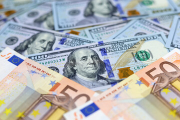 US dollars and euro banknotes. Concept of exchange rate, investment and trade between the United States and European Union