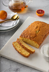 Orange pound cake with fresh bloody orange. Vertical