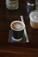 coffee paper cup on the wooden table