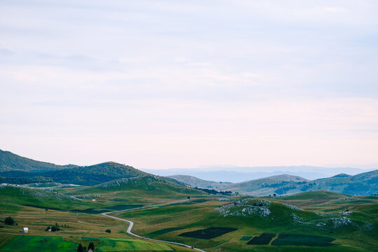 Road in a green valley in the Durmitor national park. Montenegro © Nadtochiy