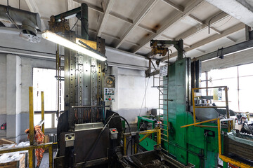 Modern automobile manufacturing workshop. Factory with steel constructions. Plant of car production. Industrial scenery background