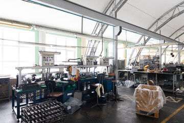 Photo of automobile assembly production. Factory with steel constructions. Engine factory. Plant concept and interior. Industrial scenery background