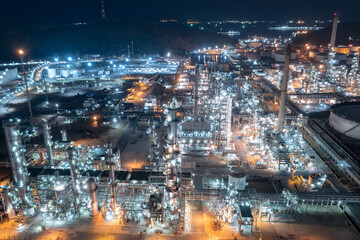 Fototapeta na wymiar Chemical industry storage tank and oil refinery in Industrial Plant at night over lighting, Fuel and power generation, petrochemical factory industry zone