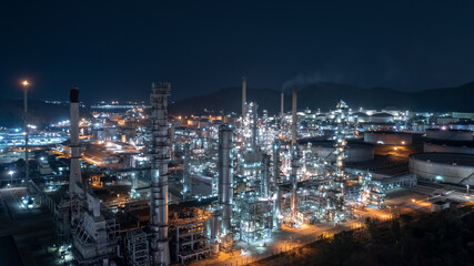 Chemical industry storage tank and oil refinery in Industrial Plant at night over lighting, Fuel and power generation, petrochemical factory industry zone
